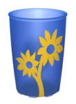 Kuvassa Liukumaton, läpikuultava muki keltaisella kukkakuviolla - sininen